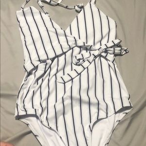 New one piece. Size M.